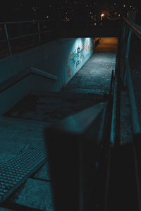 High angle view of illuminated text on wall by swimming pool