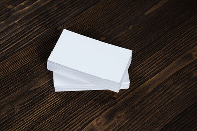 High angle view of open book on wooden table