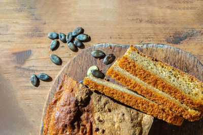 High angle view of bread on cutting board