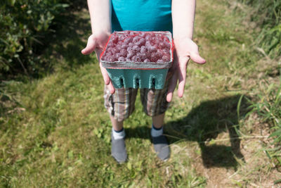 Low section of man standing on ground