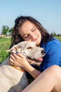 Midsection of a woman with dog