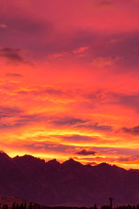 Scenic view of mountains against sky at sunset