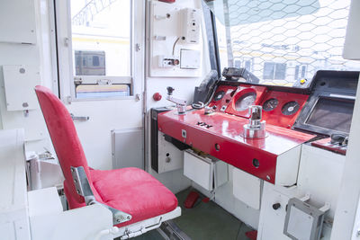 Empty seats in front of dashboard of locomotive