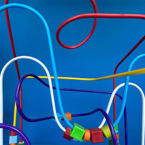 Close-up of multi colored wire against blue background