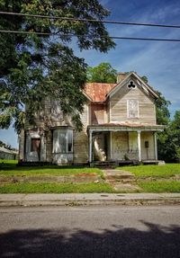 House by building against sky