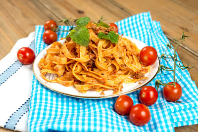 Elevated view of tagliatelle and meat sauce