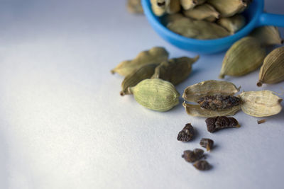Closeup dried green elettaria cardamomum fruits with seeds, cardamom spice or organic elaichi 