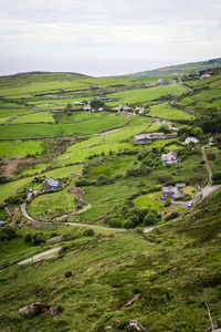 Scenic view of green landscape against sky