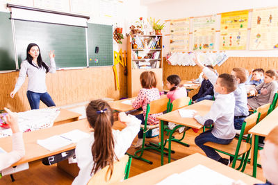 Teacher teaching at classroom