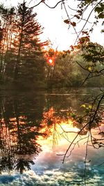 Scenic view of lake at sunset