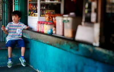 Boy standing outdoors