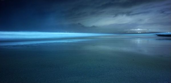 Scenic view of sea against sky at dusk