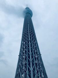 Low angle view of tower against cloudy sky