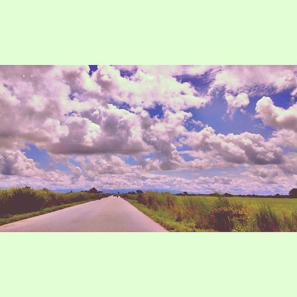 sky, the way forward, cloud - sky, diminishing perspective, landscape, vanishing point, tranquility, nature, tree, tranquil scene, cloud, beauty in nature, road, scenics, cloudy, field, auto post production filter, transfer print, day, rural scene