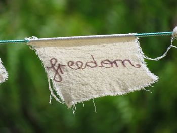 Close-up of clothes drying on rope