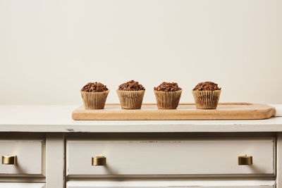 Close-up of cupcakes against white background