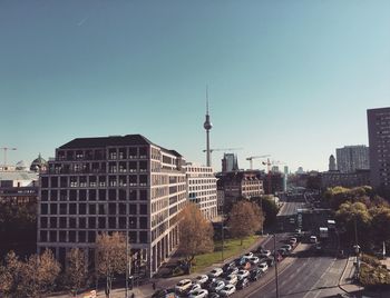 View of cityscape against clear blue sky