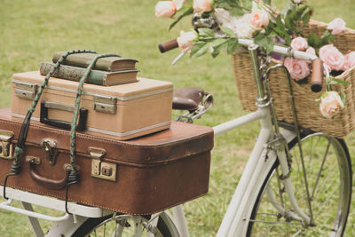 Vintage bicycle on the field with a bag