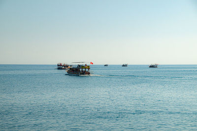 Boat in sea against clear sky