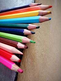 High angle view of multi colored pencils on table