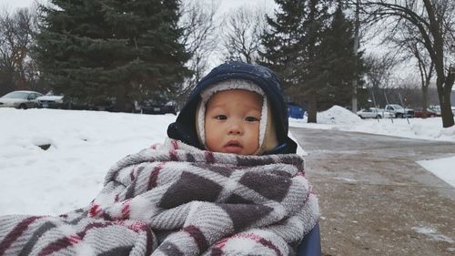 Woman covering face covered with snow