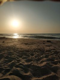 Scenic view of sea against clear sky during sunset