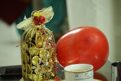 Close-up of tomatoes in glass container on table