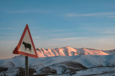 Traffic sign against mountains