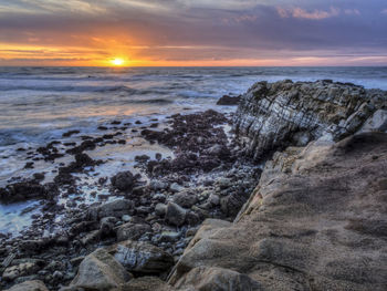 Scenic view of sea against sky at sunset