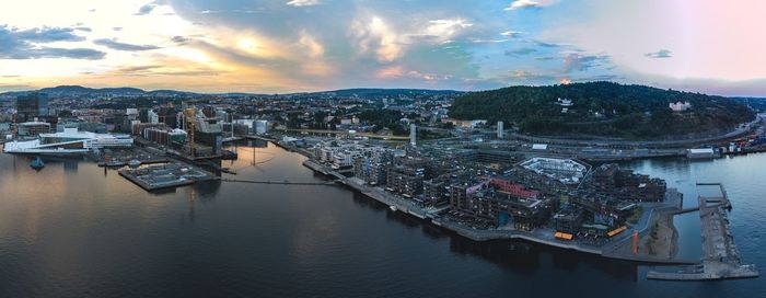 High angle view of bay and buildings against sky