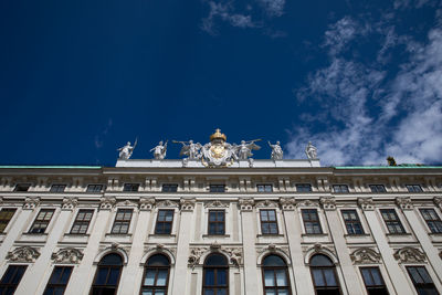 Low angle view of building against blue sky