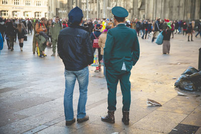People on sidewalk in city