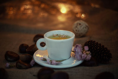 Close-up of cup and coffee on table