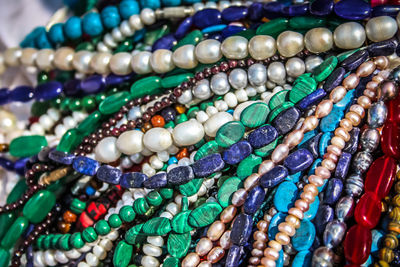 Close-up of multi colored jewelry for sale in market