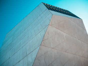 Low angle view of modern building against clear blue sky