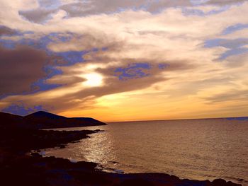 Scenic view of sea against sky at sunset