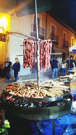People for sale at market stall