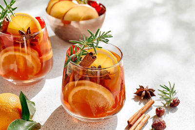 Mulled wine or christmas sangria with aromatic spices, apple, cherry and citrus fruits.