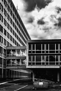 Road by building against sky in city