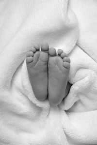Close-up of baby feet in blanket