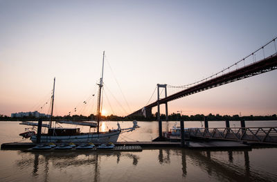 Sailboats in marina at sunset
