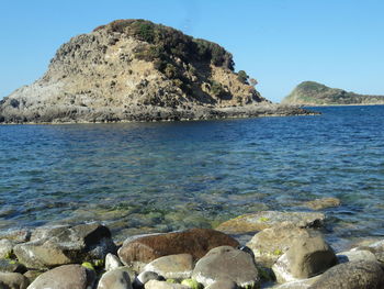 Scenic view of sea against clear blue sky