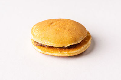 Close-up of cake against white background