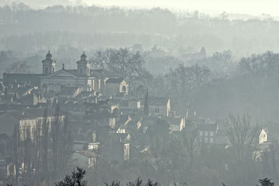 High angle view of trees and buildings during winter