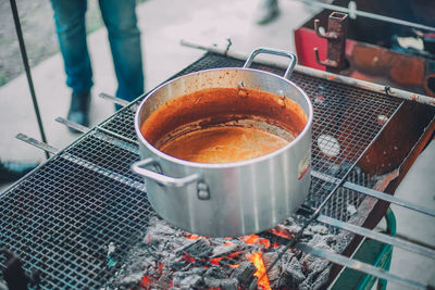 Close-up of preparing tea on barbecue grill