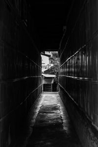Narrow footpath amidst buildings