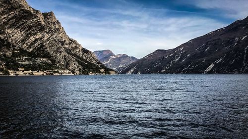 Scenic view of lake and mountains against sky