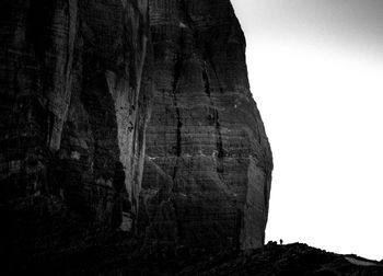 Low angle view of rock formation against sky