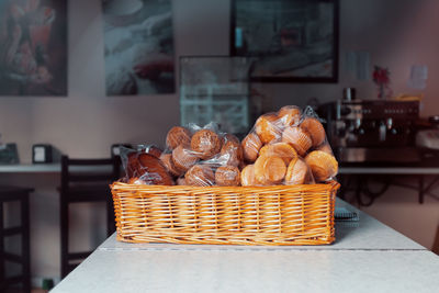 Close-up of desserts in basket on table at home