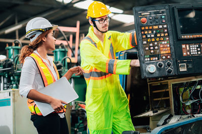 Engineers discussing at factory